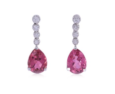 A PAIR OF TOURMALINE DIAMOND EARRINGS
Featuring a pair of pear shaped pink tourmalines weighing approximately 2.66 Cts, mount