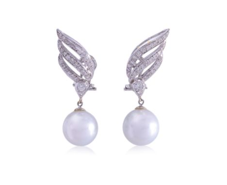A PAIR OF SOUTH SEA CULTURED PEARL AND DIAMOND 'WINGS' EARRINGS
Featuring a pair of round south sea cultured pearls measuring