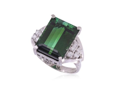 A GREEN TOURMALINE AND DIAMOND RING
Featuring an emerald cut green tourmaline weighing approximately 10.47 Cts (marked), moun