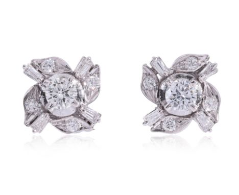 A PAIR OF DIAMOND 'WINDMILL' STUD EARRINGS
Featuring a pair of round brilliant cut diamonds totalling approximately 0.40 Cts 