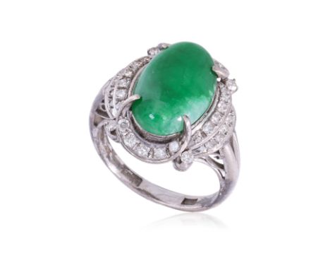 A JADE AND DIAMOND RING
Featuring a green jade cabochon mounted in a white metal setting, marked 'Bao Rong' in Chinese charac