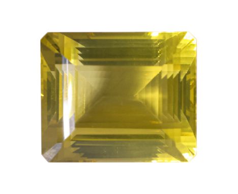 A VERY LARGE UNMOUNTED LEMON QUARTZ
Featuring an emerald step cut lemon quartz weighing approximately 129.15 Cts, eye clean, 