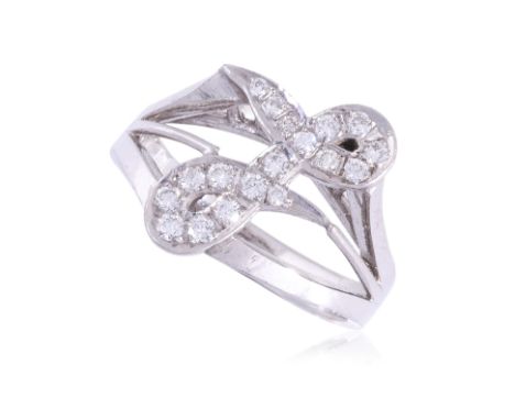 A DIAMOND RING
Featuring round brilliant cut diamonds totalling approximately 0.24 Cts, mounted in a white gold setting marke