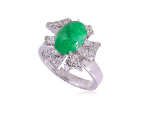 A JADEITE AND DIAMOND RING
Featuring a green jadeite cabochon mounted in a white gold setting marked '18K', alongside other m
