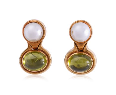 A PAIR OF CULTURED PEARL AND PERIDOT CLIP ON EARRINGS
Featuring a pair of cultured pearls measuring approximately 8.5-9.0mm a