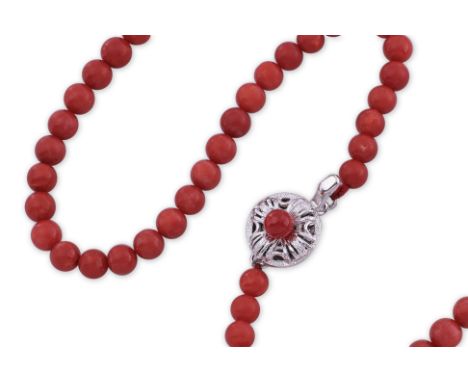 A RED CORAL BEAD NECKLACE
Featuring red coral beads measuring approximately 5.0-5.7mm, attached to a silver clasp marked 'sil