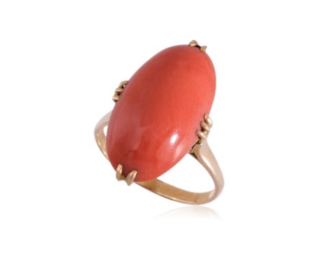 A CORAL RING
Featuring a coral cabochon measuring approximately 22.0 x 11.5mm, mounted in a yellow gold setting marked 'K18' 