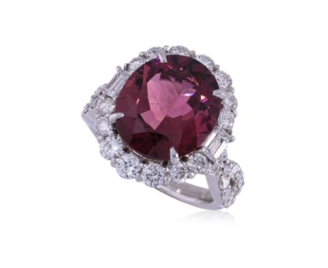 A PINK TOURMALINE AND DIAMOND RING
Featuring an oval cut pink tourmaline weighing approximately 8.00 Cts, mounted in a platin