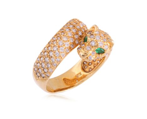 AN EMERALD AND DIAMOND 'CROSSOVER' RING Featuring round brilliant cut diamonds totalling approximately 1.52 Cts (marked), mou
