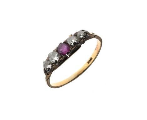 Dress ring set central ruby coloured stone and four graduated diamonds, the shank stamped 18ct, size W   Condition: 