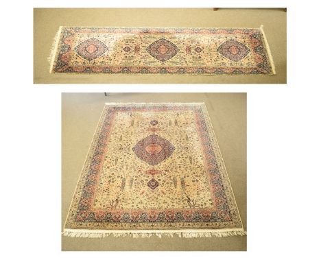 Middle Eastern style Wilton carpet decorated with a central medallion on a floral patterned beige ground within multi borders