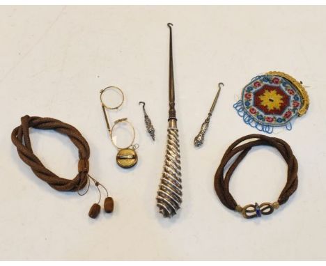 Large silver handled button hook, two small similar button hooks, beadwork purse, two woven hair bracelets and a pair of gilt