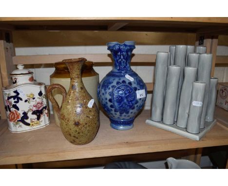 A German salt glazed jug together with tea caddy and others and a contemporary green tubular vase