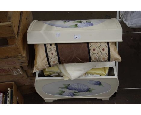A cream painted domed trunk and a quantity of assorted household linens