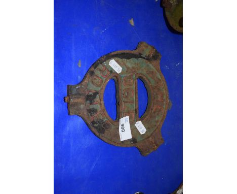 An iron implement plate marked The Ogle Roller, made by Derby Cast Well Foundry