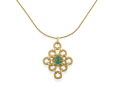 the oval cabochon emerald in a yellow claw setting, within an articulated textured kite-shaped border formed of circular link