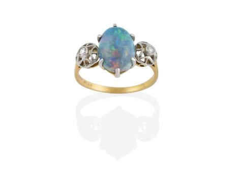 the oval cabochon opal in a white claw setting, flanked by eight-cut diamonds in rubbed over settings to a pierced border, to