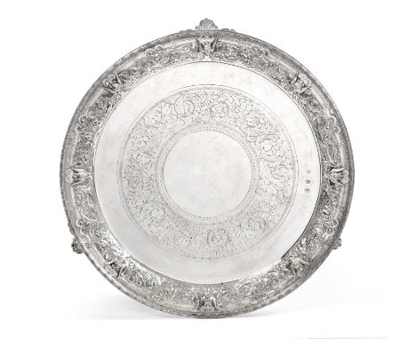circular and on three foliage-cast panel feet, the rim cast with winged masks and Renaissance style foliage and swags on a ma