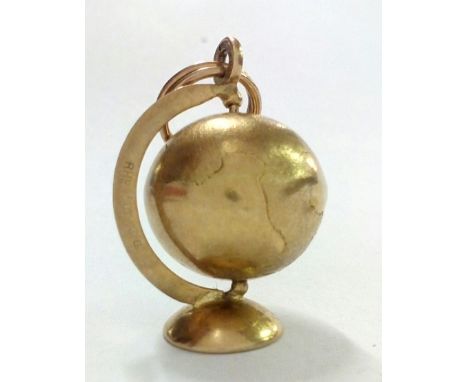 9 carat gold globe charm, 3.8 grams 