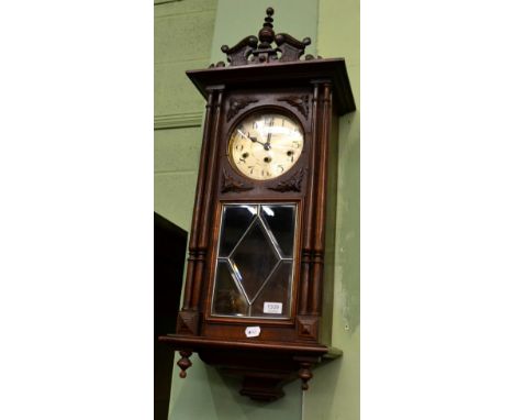 A 1930s chiming wall clock, chiming on eight gong rods
