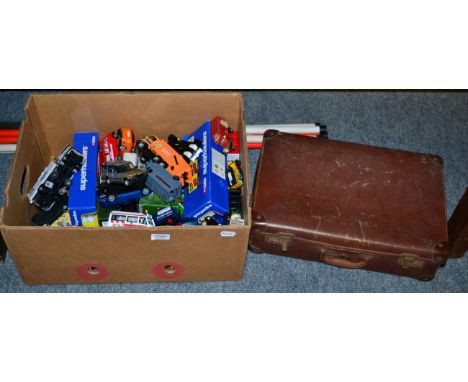 A box and a suitcase of vehicles including Lledo, Matchbox and Corgi