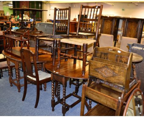 A group of oak furniture including a 1920s two tier trolley, occasional table, magazine rack, 1920s gate leg table, two rush 