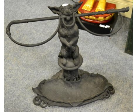 A Coalbrookdale style iron stick stand in the form of a chihuahua and riding crop 