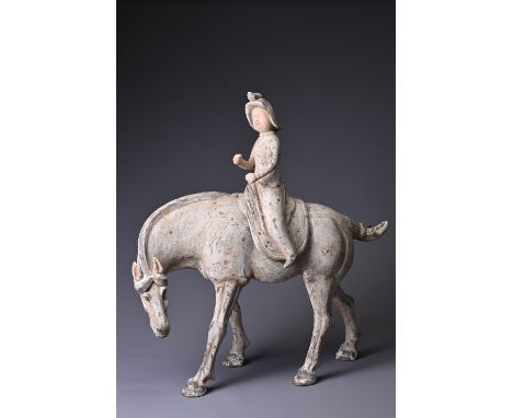 A LARGE CHINESE PAINTED POTTERY HORSE WITH A FEMALE RIDER, WITH TL TEST. The rider modelled separately on saddle seated astri