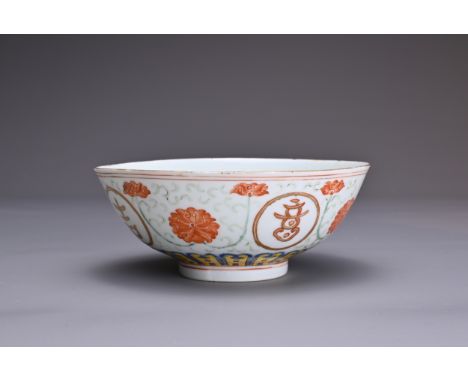 A CHINESE POLYCHROME ENAMEL PORCELAIN BOWL, 19TH CENTURY. Rounded body decorated with chrysanthemum scrolls and four Tibetan 