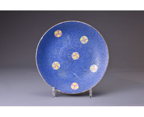 A CHINESE BLUE GROUND SGRAFFIATO PORCELAIN DISH, 19TH CENTURY. With shallow rounded sides decorated with five flower balls in