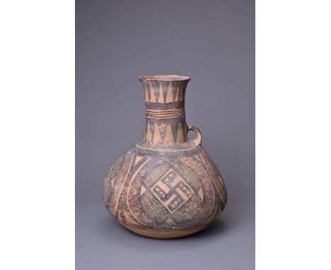 A CHINESE NEOLITHIC PAINTED POTTERY EWER, MACHANG CULTURE (2500-2000 BC). Rounded body leading into a tall cylindrical neck w