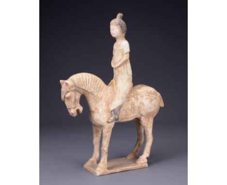 A CHINESE PAINTED POTTERY HORSE AND FEMALE RIDER, TANG DYNASTY (AD 618- 907). The horse standing foursquare with the rider se