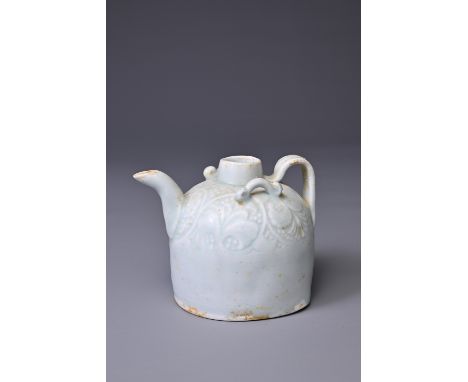 A CHINESE QINGBAI WARE EWER, SONG DYNASTY (960-1279). The domed body modelled with a ribbed strap handle and spout with added