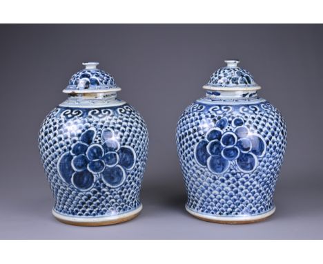 A PAIR OF CHINESE KANGXI (1662-1722) BLUE AND WHITE PORCELAIN BALUSTER VASES AND DOMED COVERS. Painted with phoenix in flight