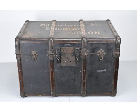 A LARGE WOODEN BOUND TRAVELLER'S TRUNK, early 20th century, with metal fittings, canvas covered top and decorative paper lini