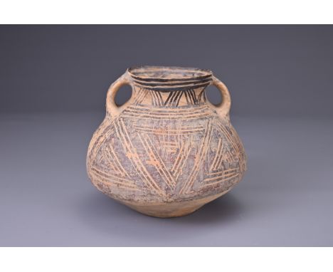 A CHINESE NEOLITHIC PAINTED POTTERY JAR, MACHANG CULTURE (2500 - 2000BC). Rounded body with a widened midsection with tapered
