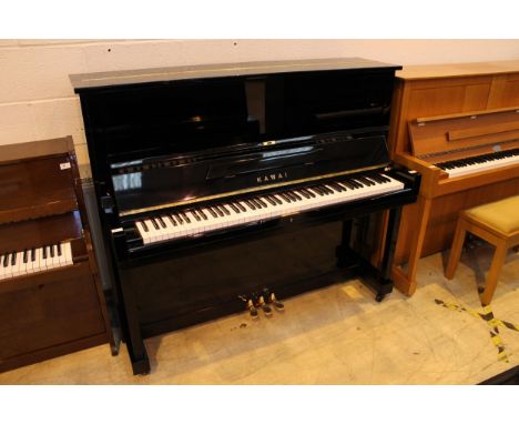 Kawai (c1960) A 125cm Model K-8 upright piano in a bright ebonised case. There is VAT on this Lot.