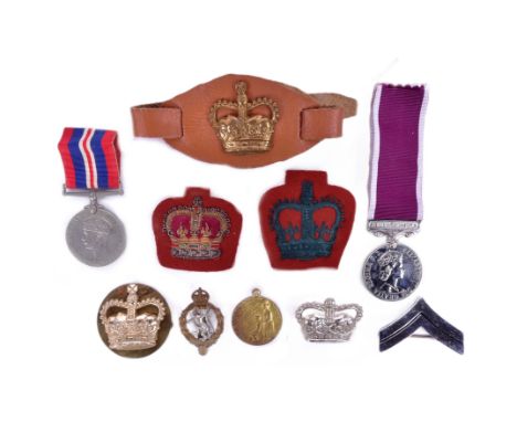 A collection of assorted Military badges and medals to include a WWI First World War French Lalique charity medal, WWII Secon