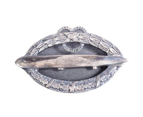 A post WWI First World War Imperial German Army Zeppelin badge. Horizontal oval shape with an airship facing left superimpose