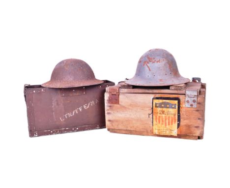 A collection of militaria comprising x2 British WWII Second World War helmets ( Brodie and Zuckerman ), a vintage 1950s Mk7 B