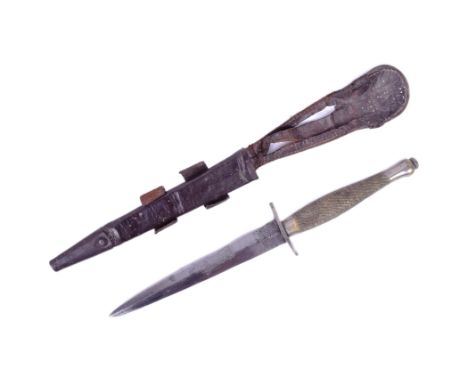 An original WWII Second World War Fairbairn Sykes issued 2nd Pattern commando fighting dagger with scabbard. Ricasso with Wil