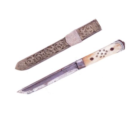 A 19th Century Tibetan / Bhutanese ladies belt knife. Bone handle secured to the tang with rivets, clipped single edged blade