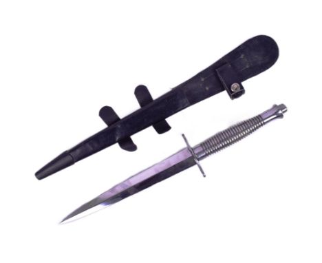 A replica British FS Fairbairn Sykes Commando knife / dagger. Stainless steel blade and solid metal ribbed grip with finger g