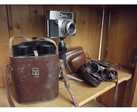 Two sets of vintage field glasses together with a vinatge camera 