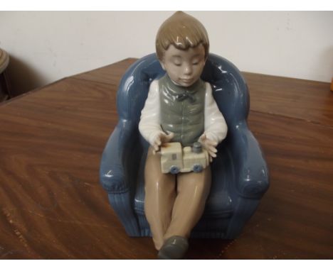 Nao figure, boy in armchair 