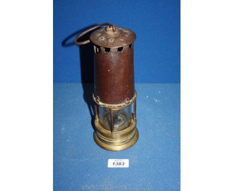An antique brass &amp; iron miner's lamp in original condition complete with hanging/carrying wire loop handle. 9 1/2" high, 