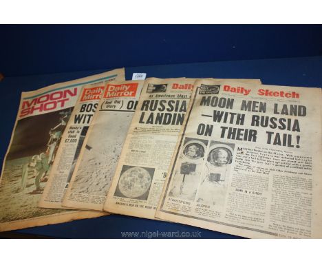 Four old newspapers from 1969 including The Daily Sketch 'Men on the Moon' edition and Daily Mail 'Footprint on the Moon' edi
