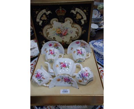 A boxed Royal Crown Derby Cabaret set of two cups, saucers, milk jug, sugar bowl and teapot (having damage, a/f.).