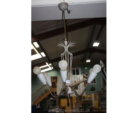 A six branch light fitting in grey and brass detail.