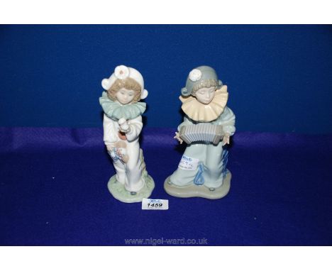Two Nao clowns, one holding a bird, the other playing a squeeze box.